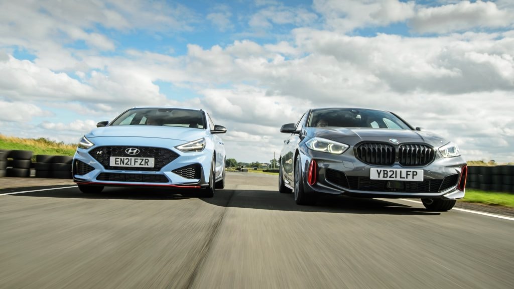 Two cars driving on a road